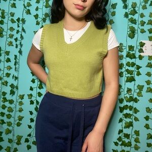 green sweater vest